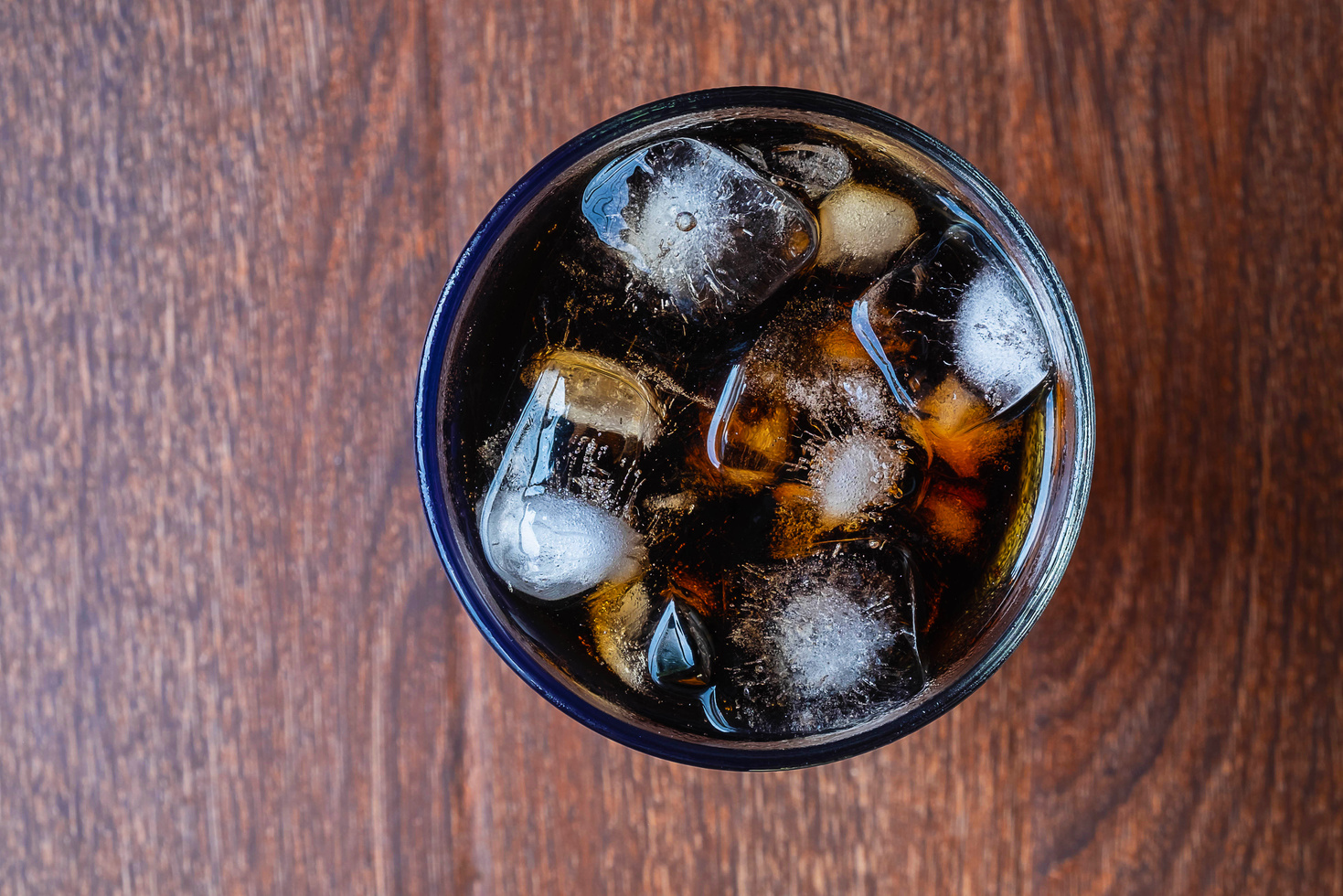 Soft Drink with Ice on Wooden Table